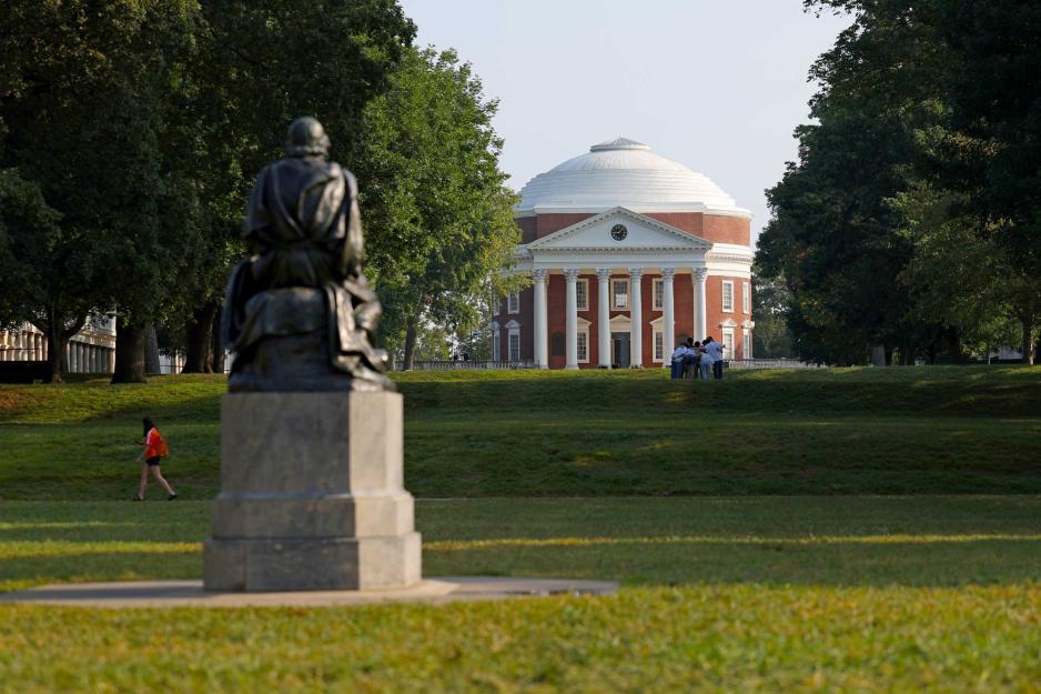 Portrait of the Homer statue viewed from behind, with the Rotunda in the background.