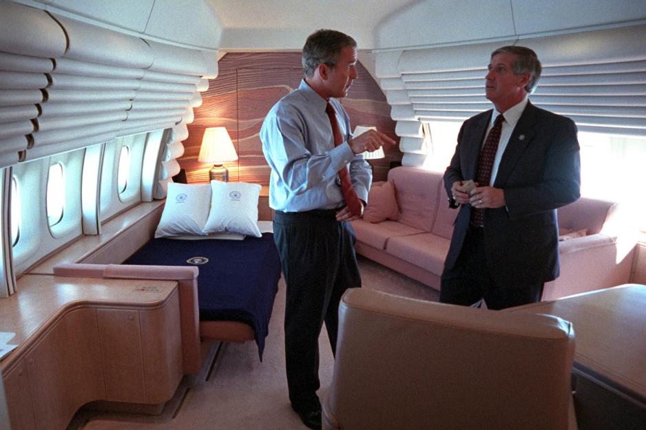 President George W. Bush and Andy Card talking on Air Force One