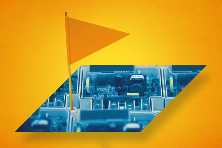 A toothpick flag stuck in a circuit board
