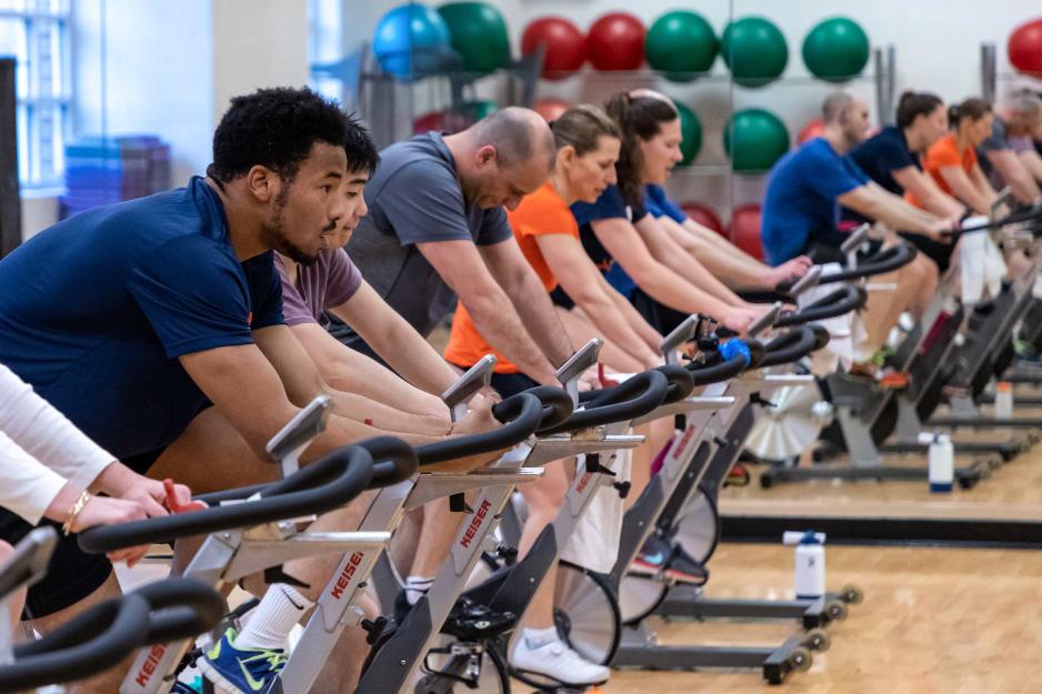 A group of people on exercise bikes in the Aquatics and Fitness Center