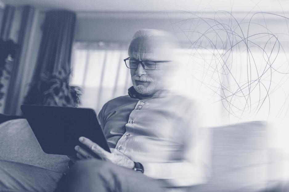 Blurred image of a man with a blue tone overlay to the picture