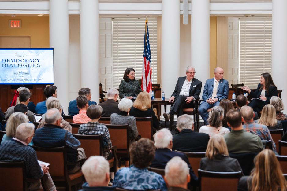 Portrait of People Engaged in a Panel Discussion on Democracy Dialogue