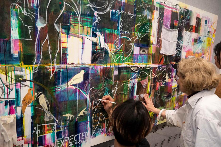 Students and faculty contributing to the ‘Fragile Beauty’ living art wall
