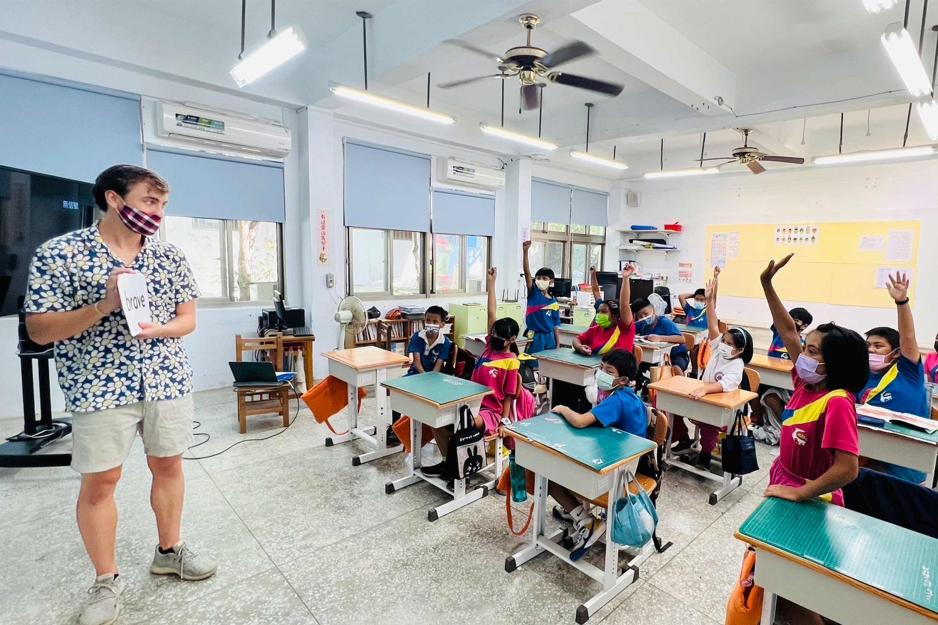 Benjamin Hazelton teaching in a classroom in Taiwan