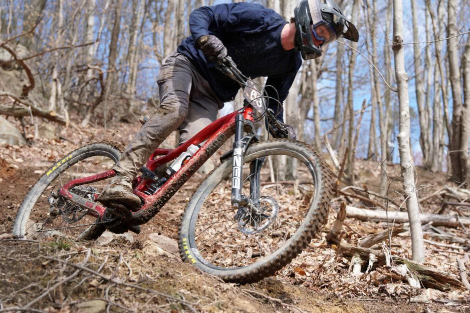 Action shot of mountain biker descending on a hill