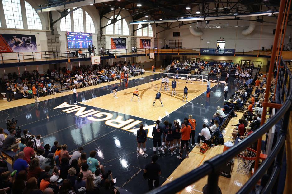 Portrait of the UVA volleyball team practicing.
