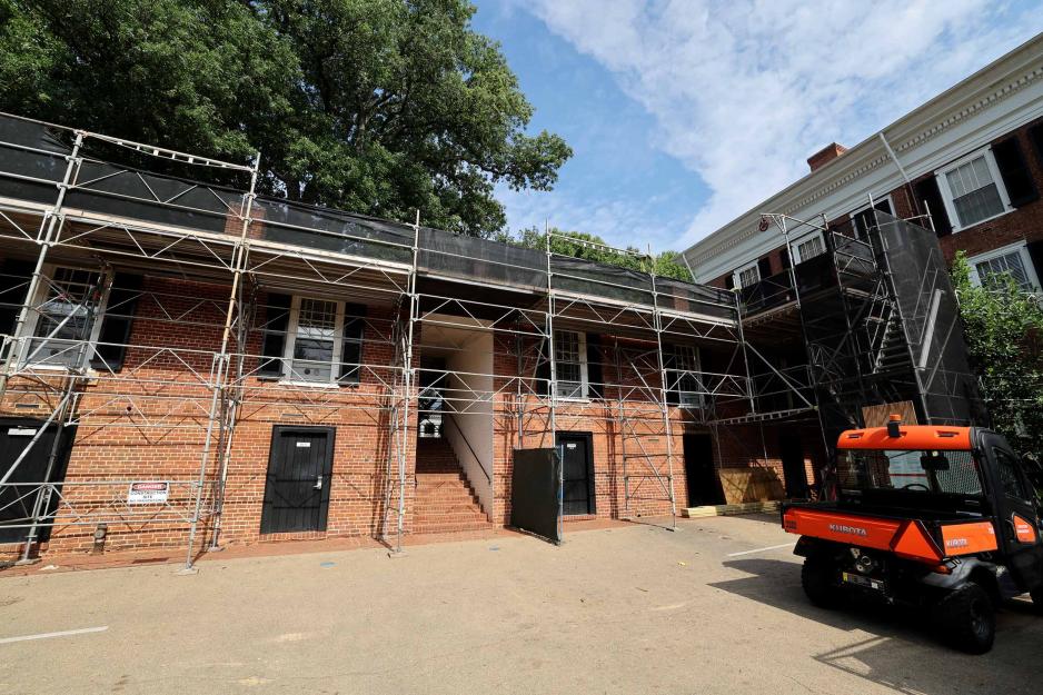 Construction rafters set up in front of building 