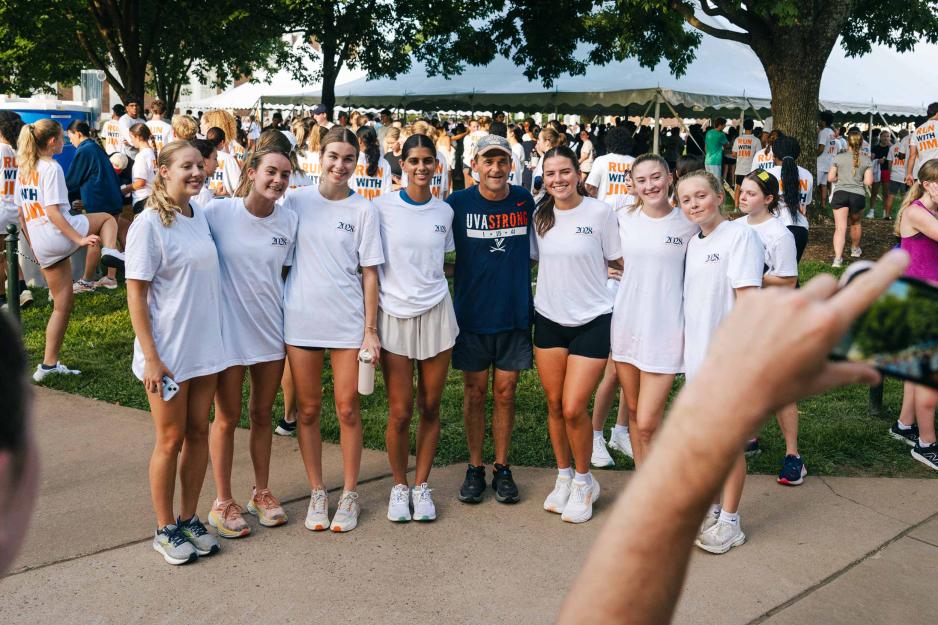 A group of students stand with President Ryan after doing the first "Run with Jim" of the year