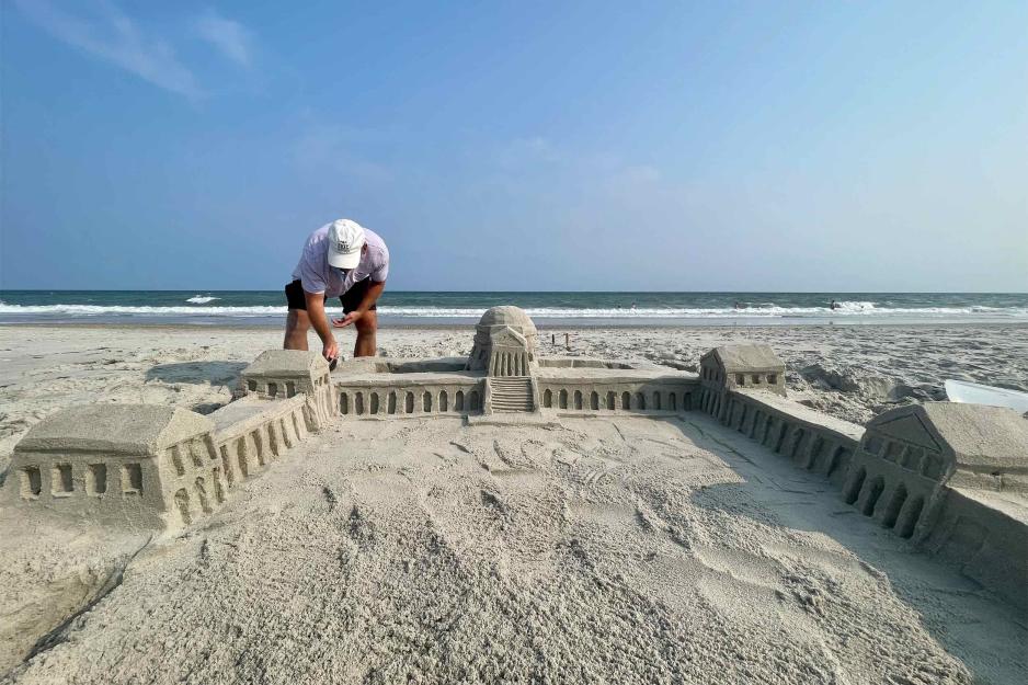 Chuck bent over the final details of his sand Rotunda