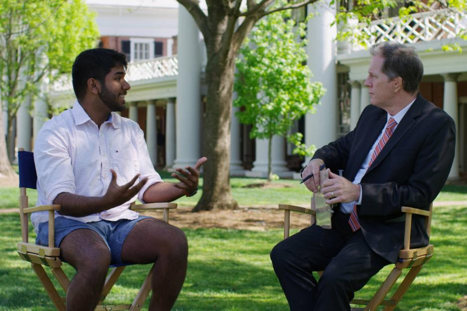 Sanjeev Kumar talking with Mike Mather in two director chairs on the Lawn.