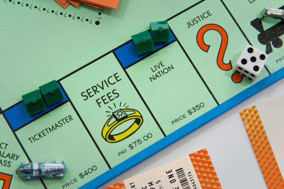 Illustration of a board game featuring monopoly with a Ticketmaster ticket on top.