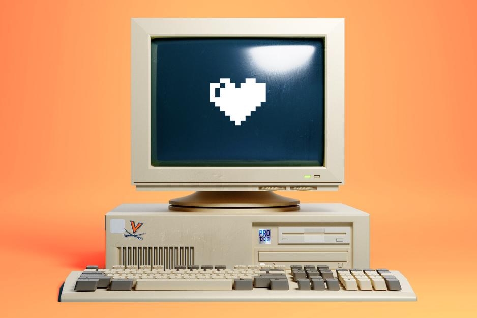 An illustration of an old computer system displaying a heart icon on the screen.