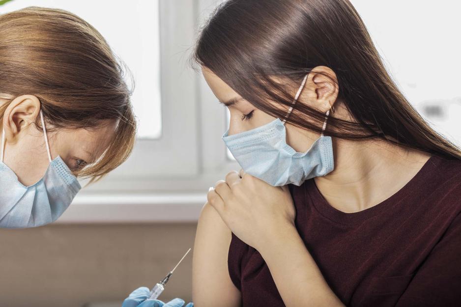 Healthcare professional giving a patient an injection