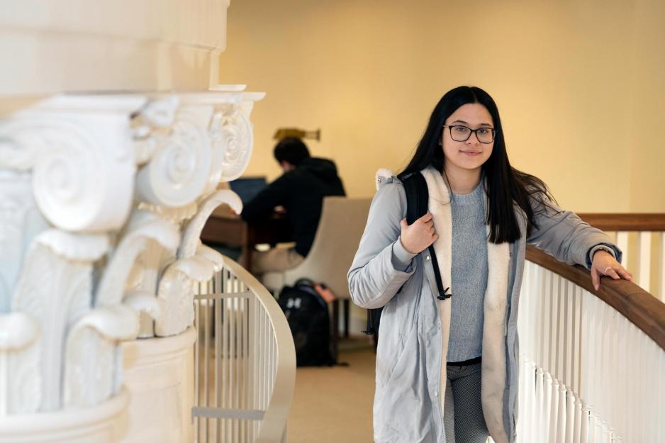 Astrid Escobar holding a railing in the Rotunda