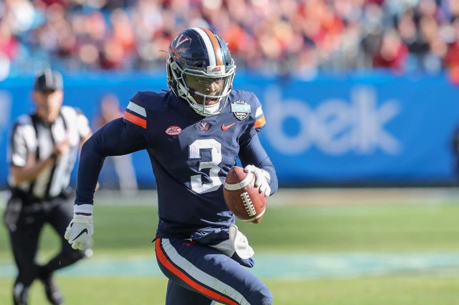 Bryce Perkins runs with the ball during the Belk bowl game