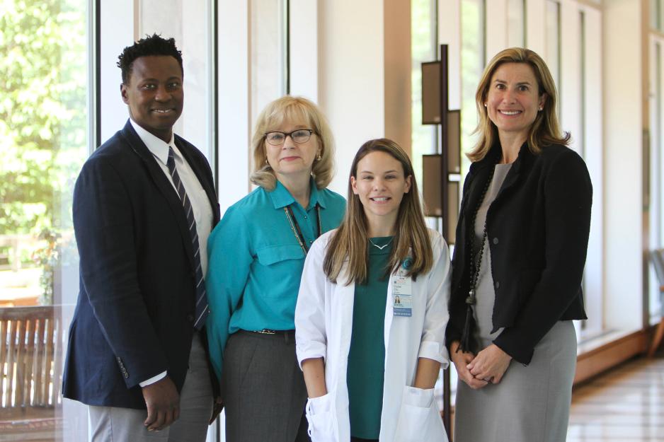 Randy Jones,  Pat Hollen, Crystal Chu, and Dr. Lynn Dengel, stand together for a group photo