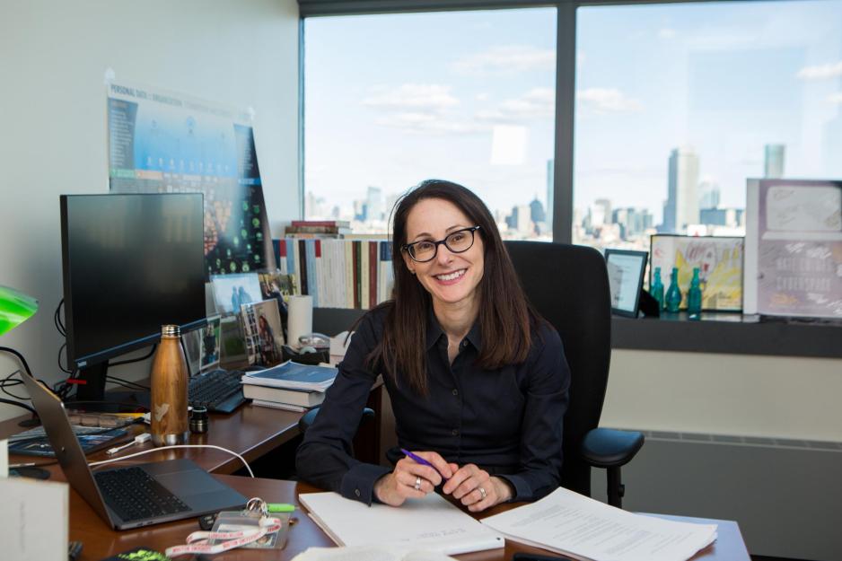 Danielle Citron sitting at her desk