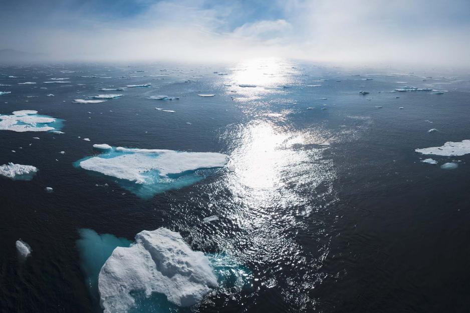 view of the ocean with floating ice chunks