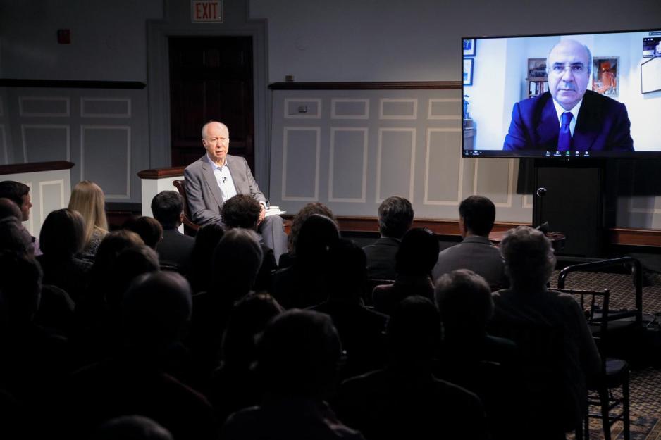 Moderator David Gergen listens to William Browder talk 