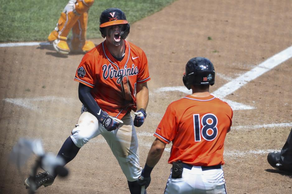 Alex Tappen crosses home plate to give teammate a high five