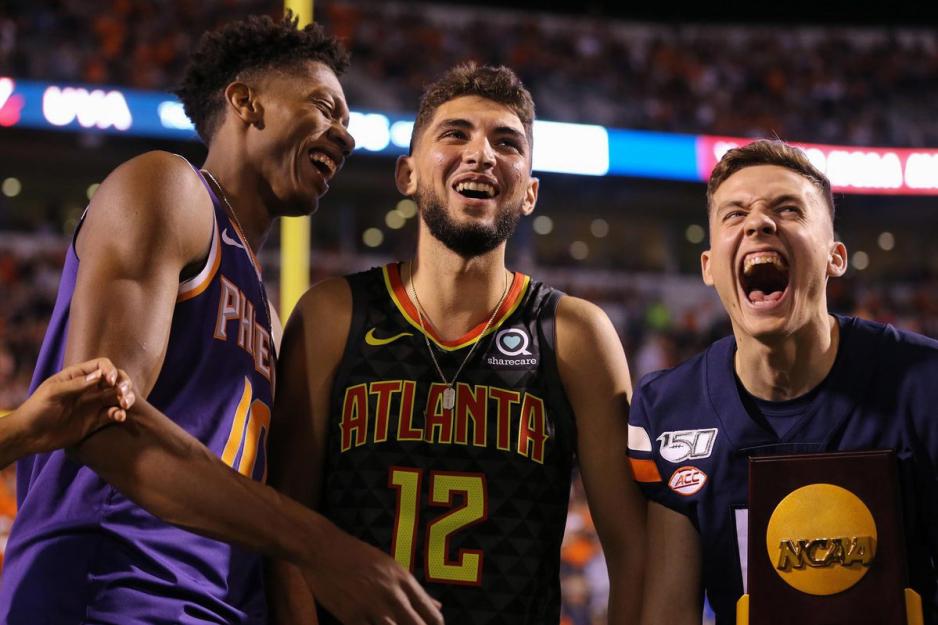 Ty Jerome, Kyle Guy and De’Andre Hunter, scream with excitement