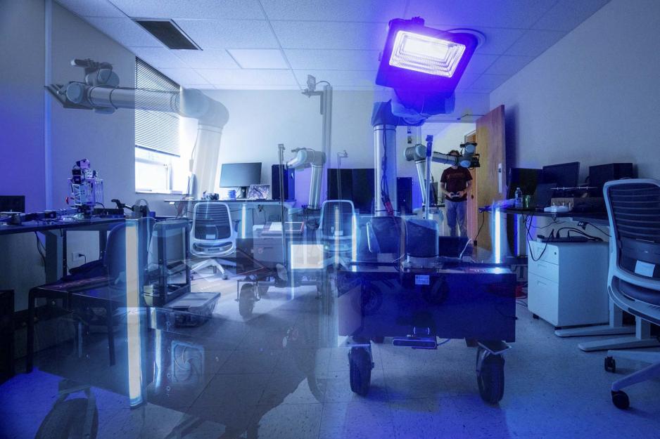 A mobile robot moving across an office floor