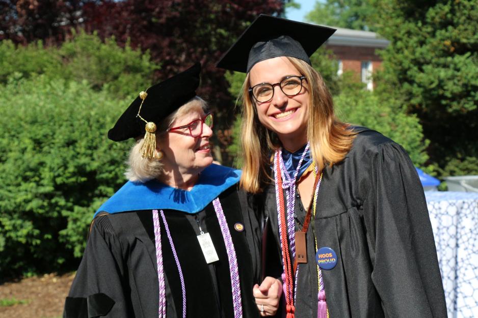 Dallas Ducar, right, with Dorrie Fontaine, wearing graduation attire pose together for a picture