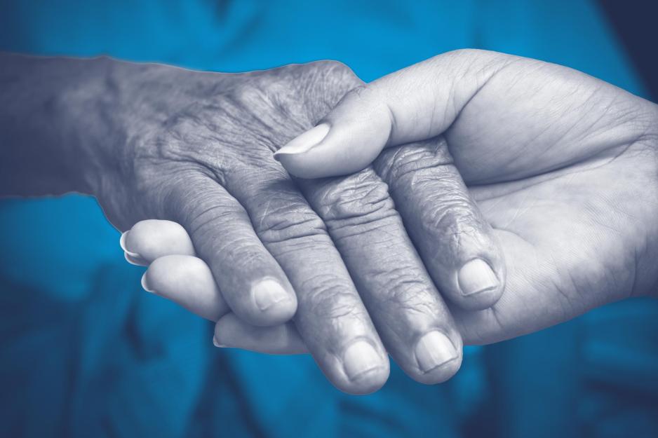 Up close view of a person holding another's hand