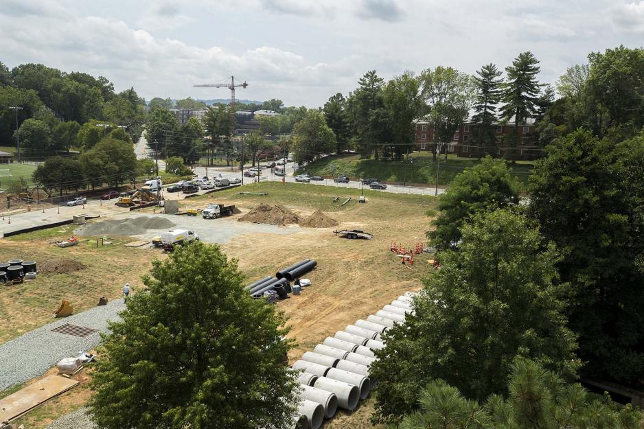 Piles of dirt, pipes, and construction vehicles in the ivy corridor construction site