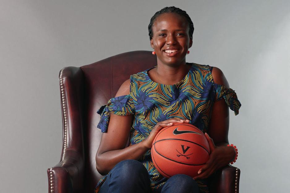 Felicia Aiyeotan sitting in a brown leather holding a basketball