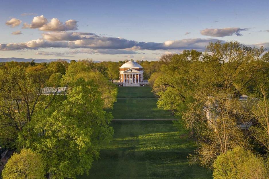 View of the Rotunda from down the Lawn with green trees on each side