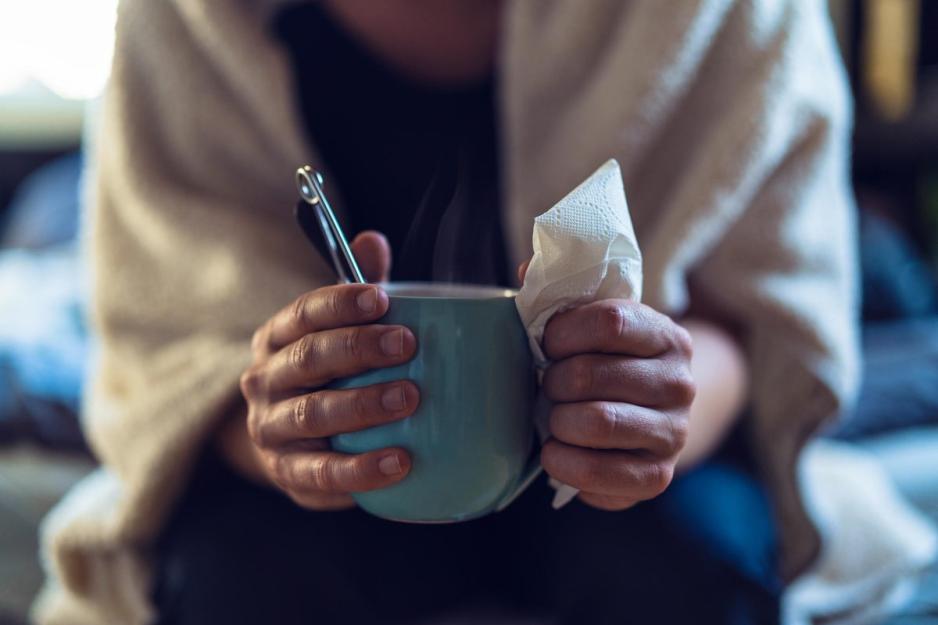 person holding a hot mug