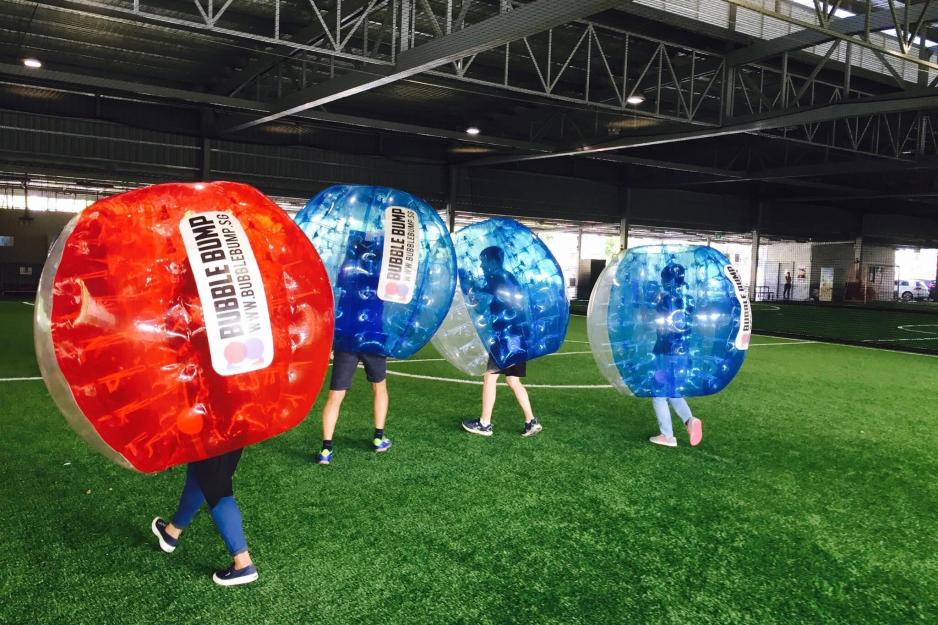 People in inflated Bubble balls playing Bubble Bump