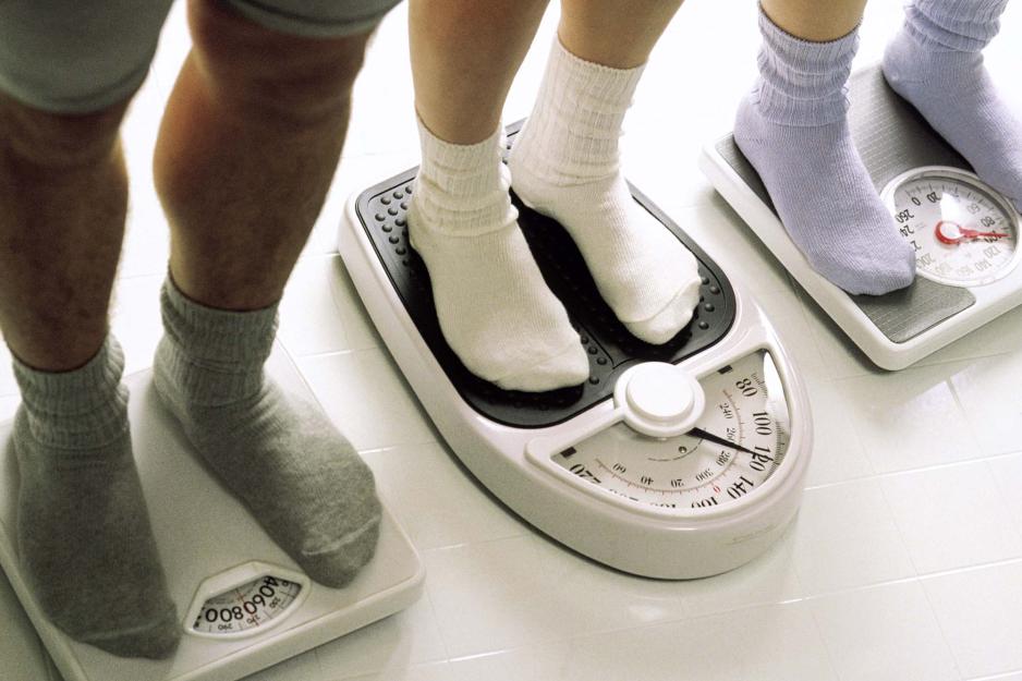 People standing on scales