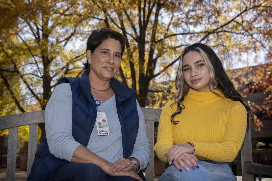 Ana Aguirre, right, and Mousumi Franks, left sitting on a park bench