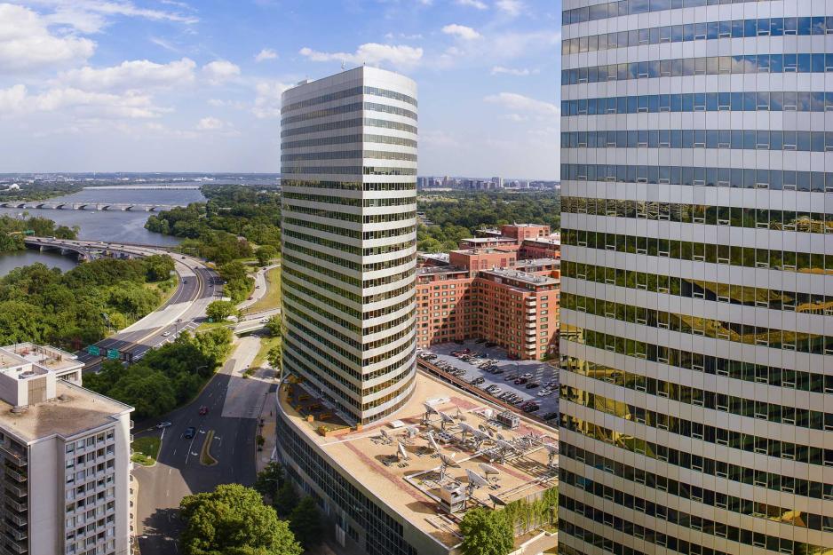 building with 2 23 story glass tear drop shaped floors on each end