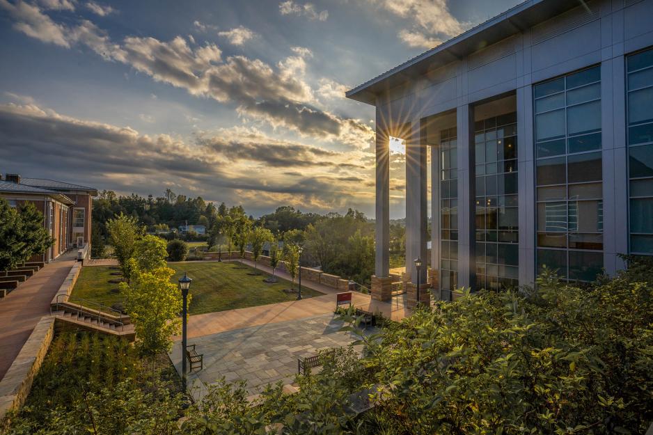 Photo of building on grounds at sunset
