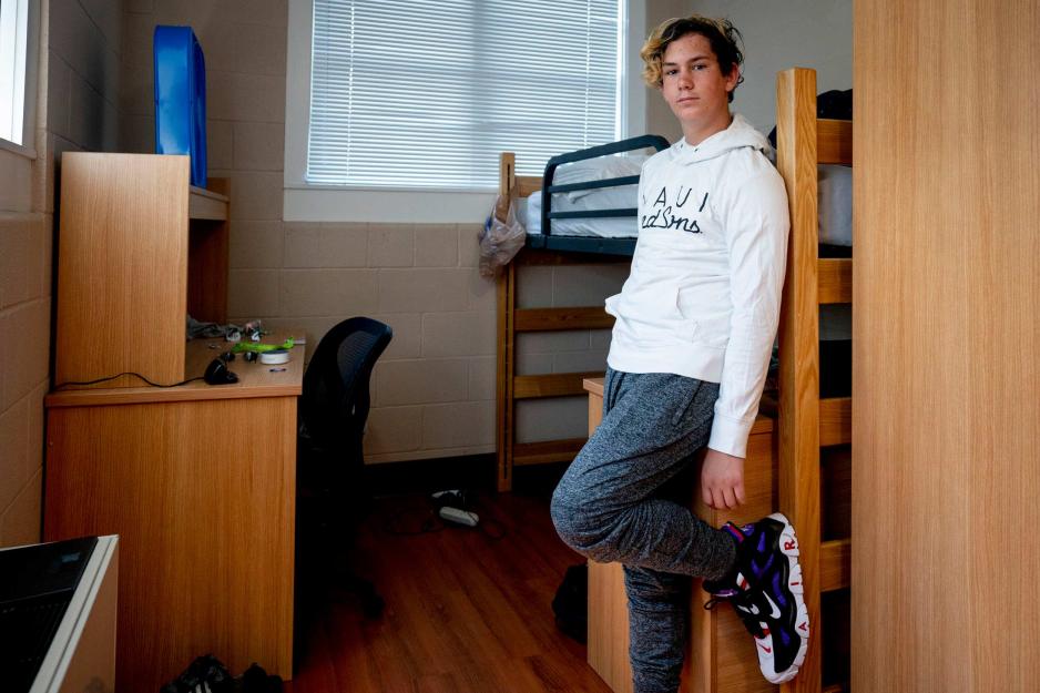 James Clayton standing in his room looking at the camera