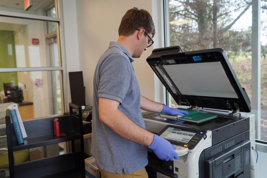 Bret Hendleston scanning a book