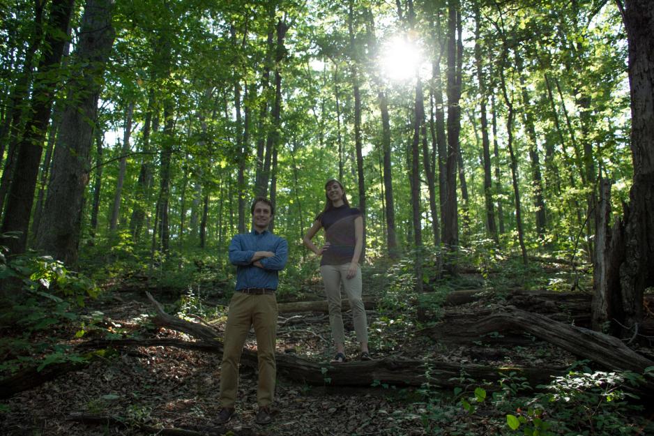 Jake Malcomb and Linnea Saby stand in a forrest