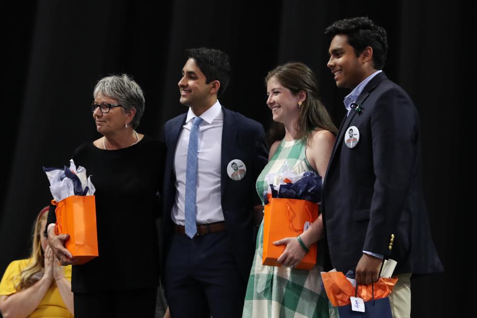 Nikhith Kalkunte, second from left,  Jane Miller, left, Jordan Arnold, and  Rehan Baddeliyanage, accepted by his brother Roshan Baddeliyanage