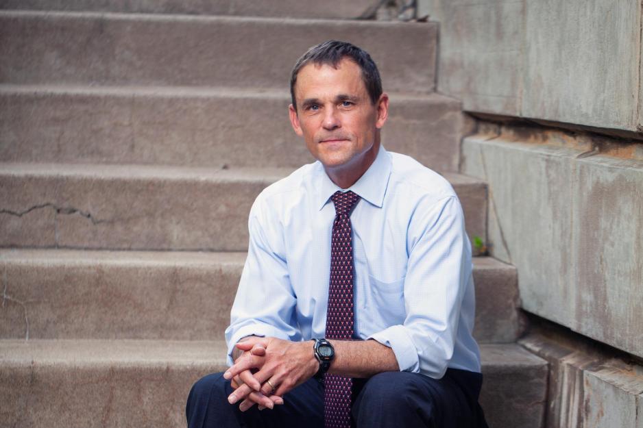 Jim Ryan sitting on steps