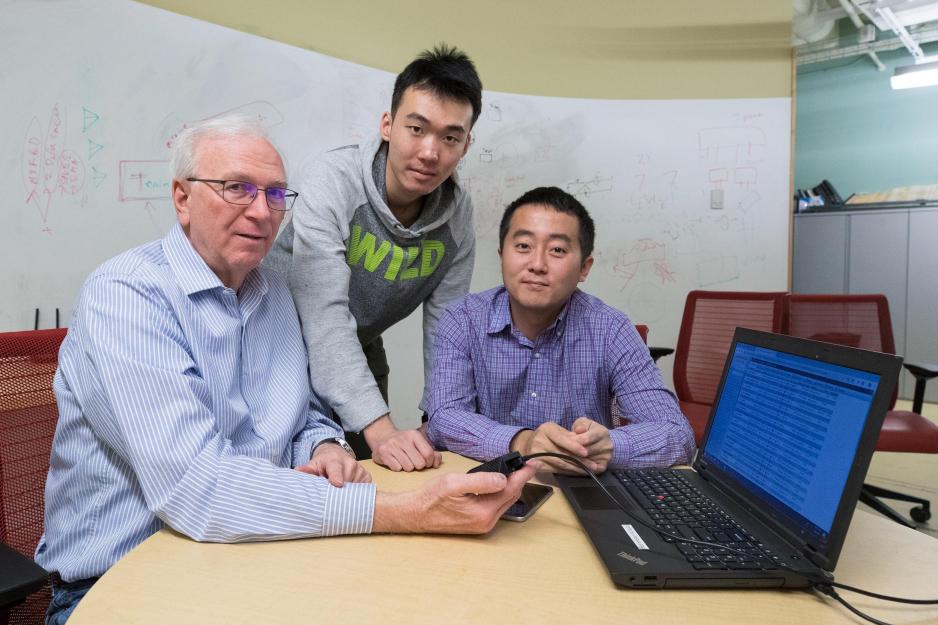 Jack Stankovic, left, Nan Wang, center, and Hongning Wang pose together for a picture