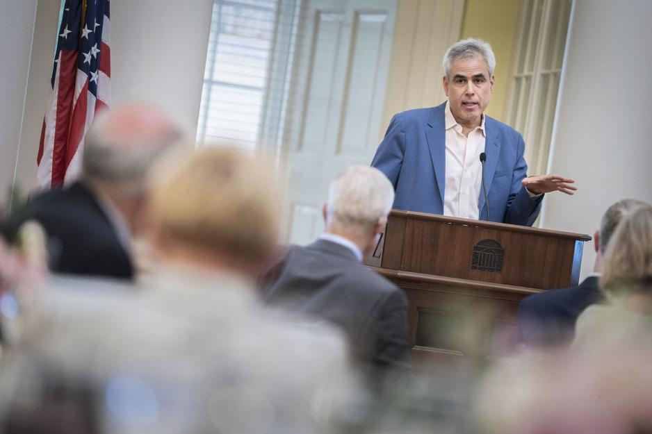 Jonathan Haidt stands at a podium giving a speech