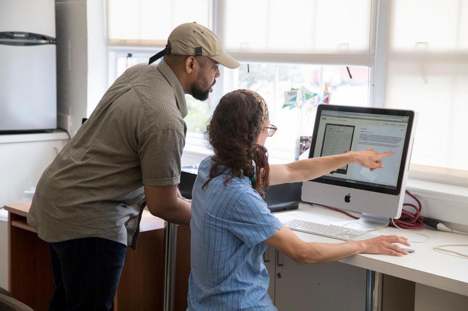 Justin Reid, left, Rachel Vigour work on a computer together