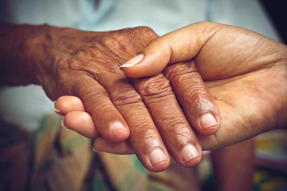 Two people holding hands