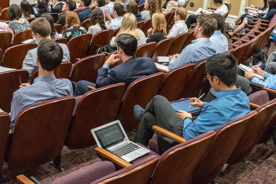Students listening to a professor during a lecture