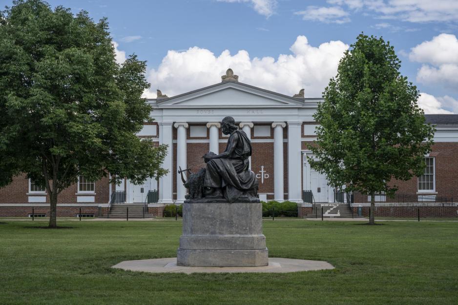 Kneeling Statue in front of a UVA building