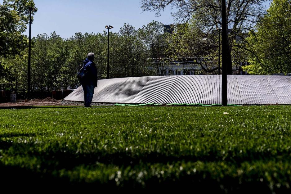 Cauline Yates stands before the Memorial of Enslaved Laborers 