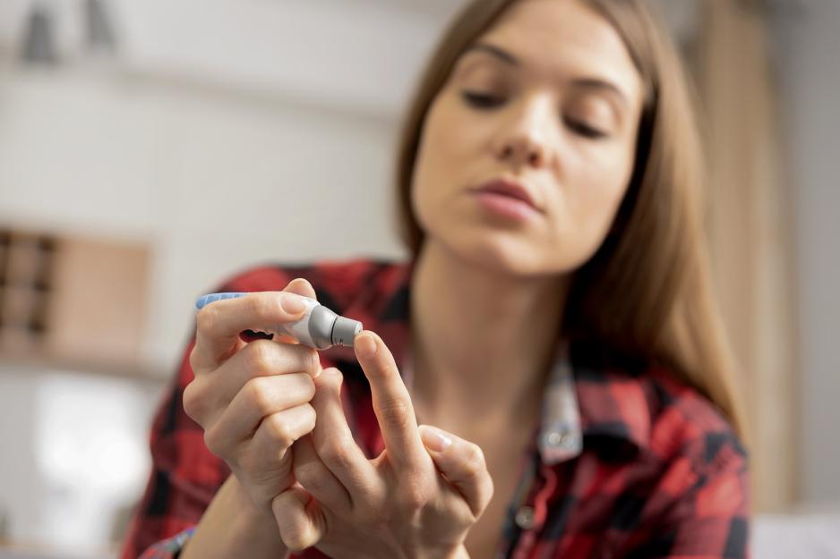 Person using the Dexcom G6 on their finger